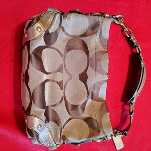 Coach, medium sized gently used purse. Gold & tan